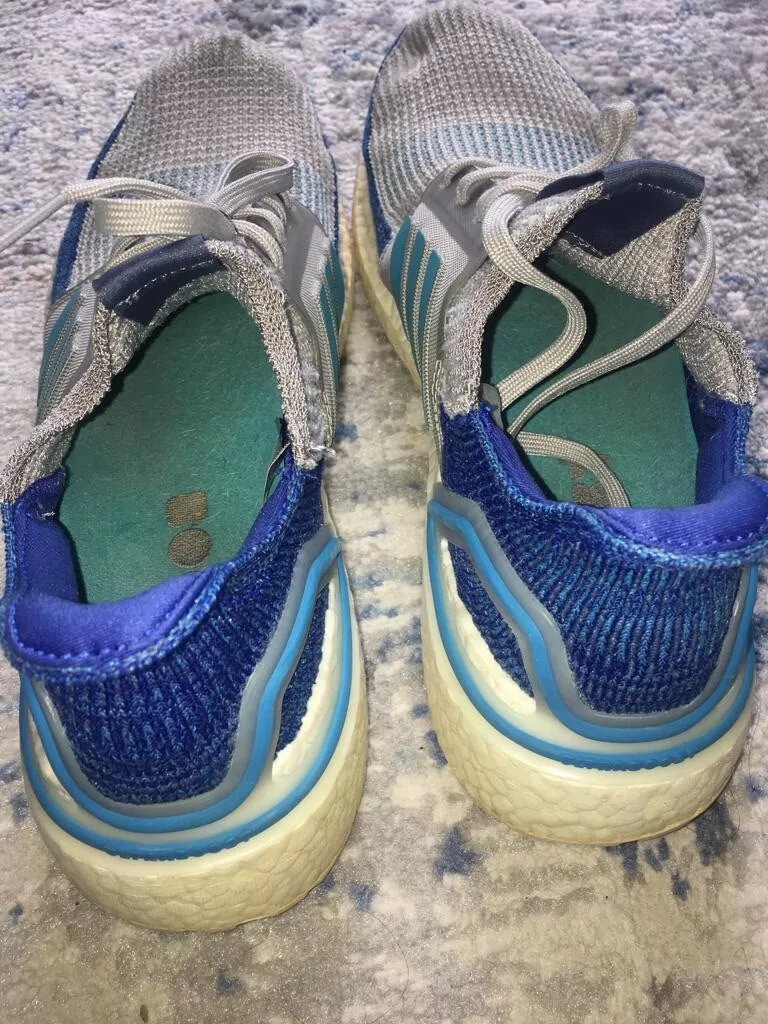 Ultra boost uncaged 2024 shock cyan
