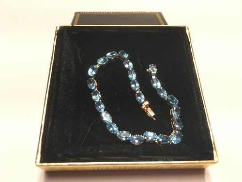 14k Gold 7" Tennis Style Bracelet with 24 Oval Cut Blue Topazs - Picture 2 of 8