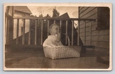 Vintage Real Photo Postcard of Baby in Basket on Porch Velox Back