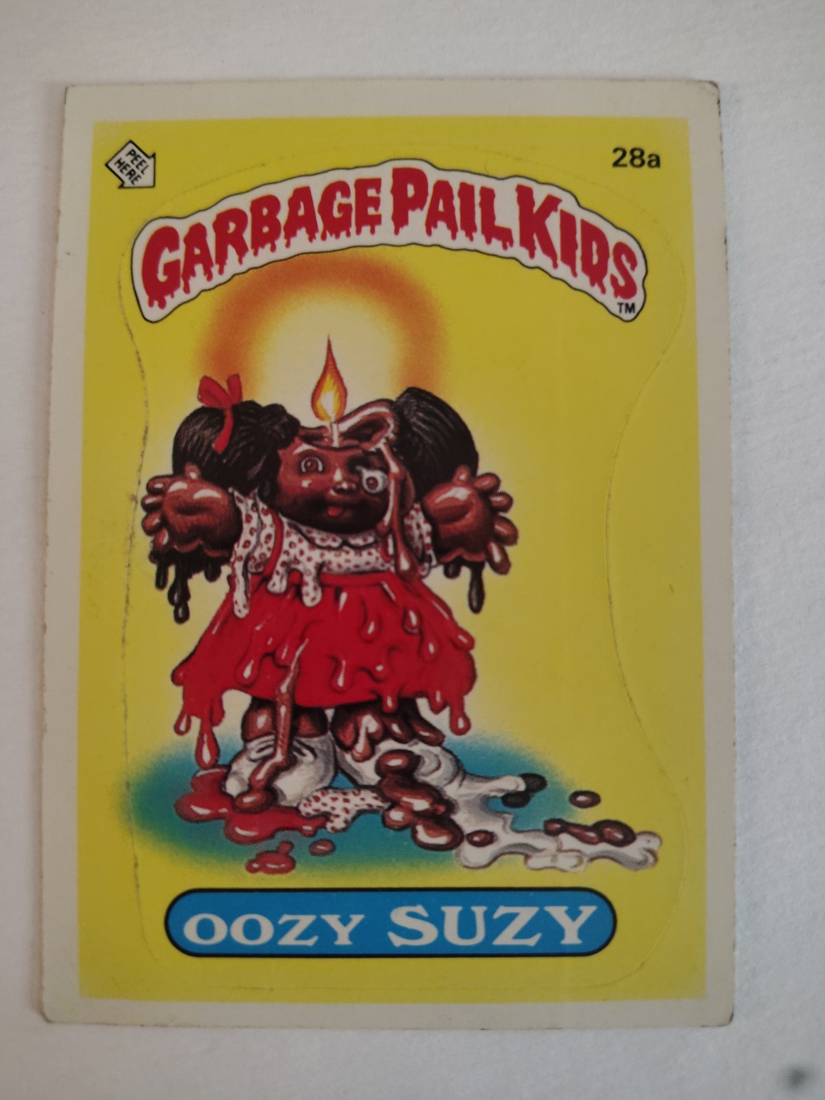 Oozy SUZIE #28a 1985 Garbage Pail Kids trading card — raw and PSA graded price guide