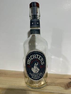 Empty Clear Corked Bottle of Michter's Small Batch Unblended American Whiskey