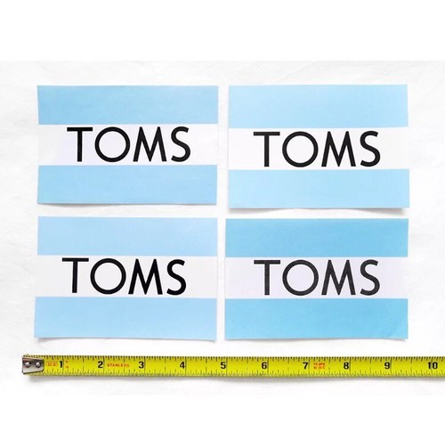 Lot of 4 new TOMS shoes brand logo stickers/decals - NOS from sealed pack - Picture 1 of 2