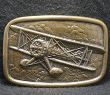 XC19131 VINTAGE 1970s  BIPLANE  AIRCRAFT AVIATION ARTWORK BRASS BELT BUCKLE