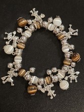Cheerleader Silver Tone Charm Bracelet With White And Brown Beads