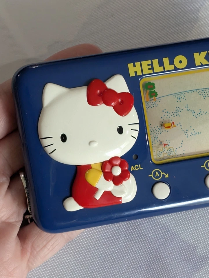 Juego digital Hello Kitty Tomy Seaside Holiday 1976 vintage Japón azul portátil Foto 4 de 4