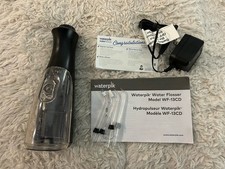 WATERPIK WATER FLOSSER MODEL WF-13CD, USED ONCE, EUC, COMES WITH INSTRUCTIONS 