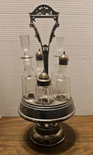 Antique Homan Silver Co. Revolving  Cruet Set 5 Crystal Etched Bottles 