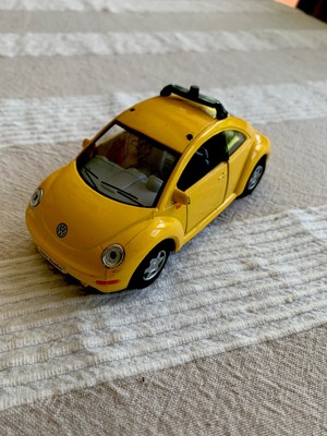 yellow volkswagen beetle toy car