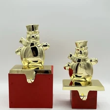 Two Gold Colored Snowman Christmas Stocking Hangers Glossy Metal Pretty Read