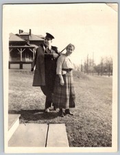 Vtg B&W Snapshot Man In Uniform & Woman In Plaid Skirt By Large Porch 1920s