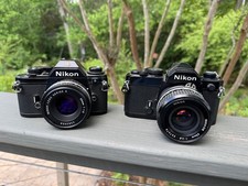 Nikon FM and Nikon EM 35mm SLR Film Cameras with lenses