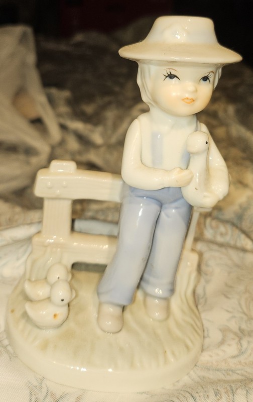 Porcelain Figurine Of A Boy With Ducks Circa Mid 20th Century