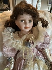 Emerald Doll Collection "Lauren" porcelain doll in Victorian attire.