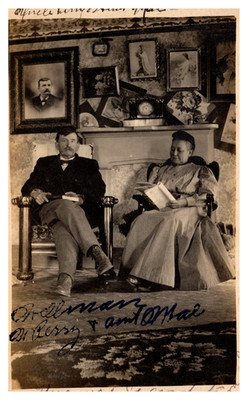 postcard Uncle Dr. Perry & Aunt Mae pose in front of their mantel B2618