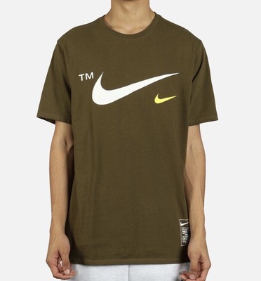 white and olive green nike shirt