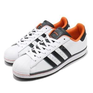 orange and white adidas superstar