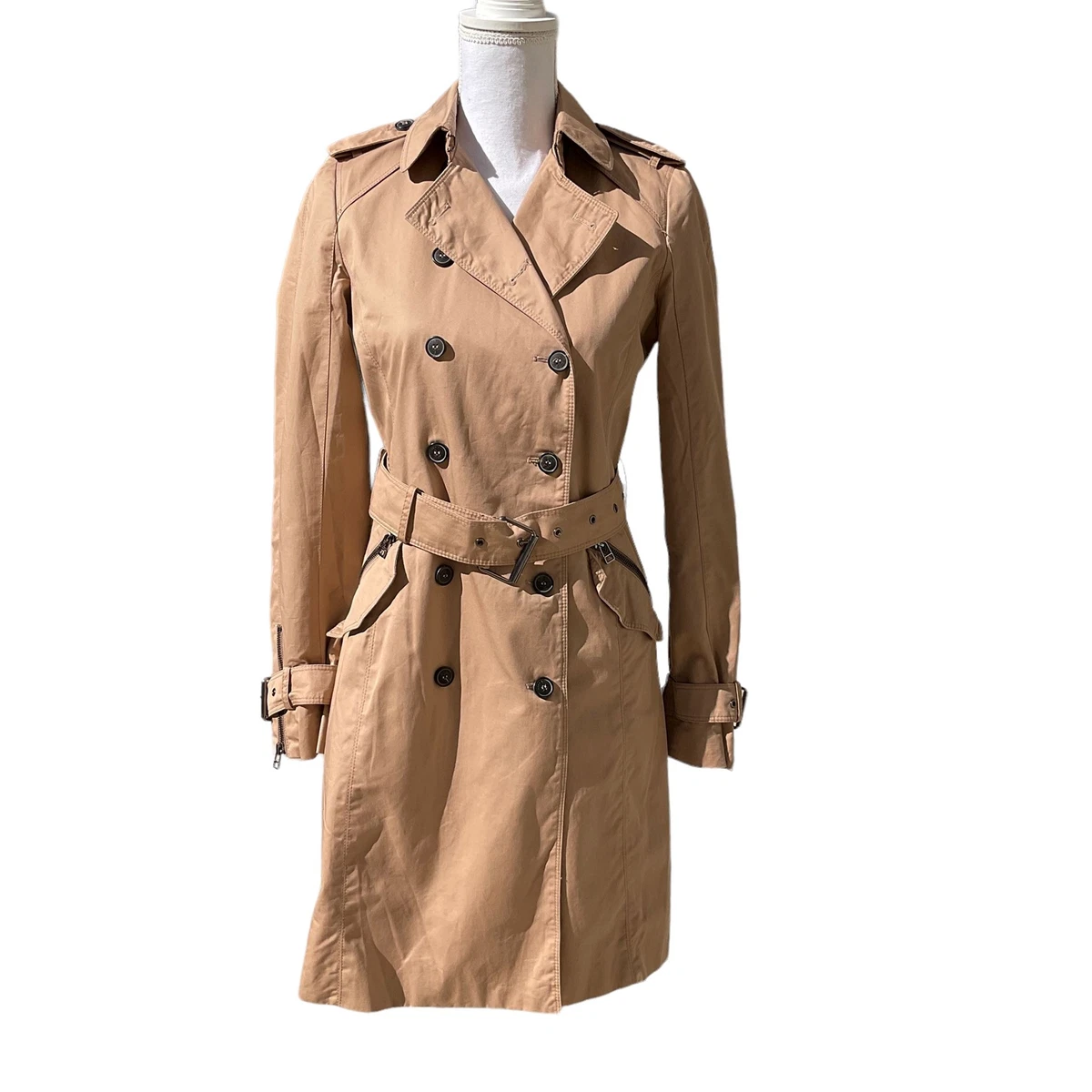 Double-breasted trench coat with belted closure