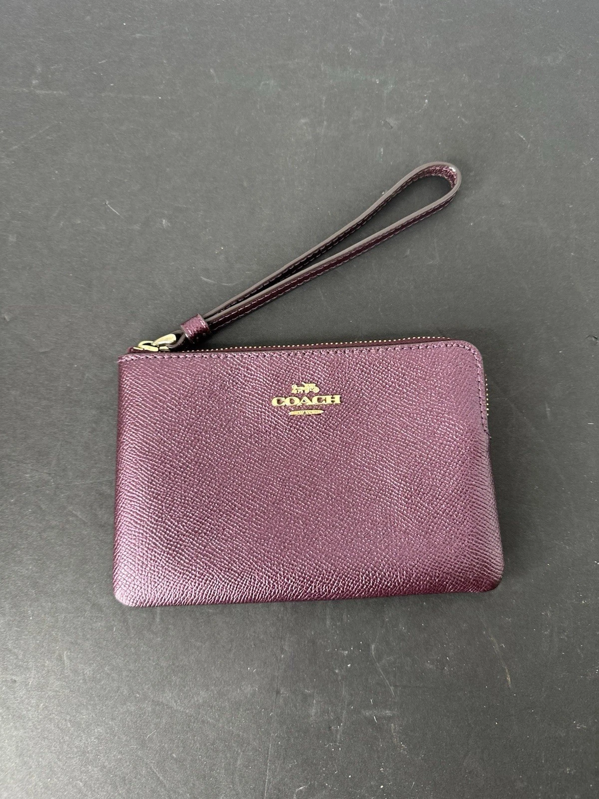 Portafoglio da polso Coach in pelle viola con cinturino