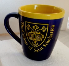 The College Of Saint Scholastica Duluth, MN Mug / Purple & Yellow by RFSJ INC.