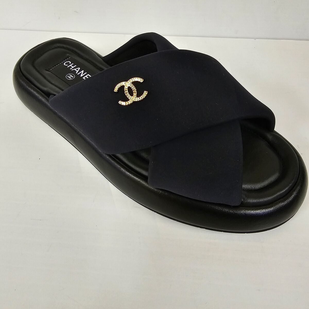 Chanel 23S G38864 Black Criss Cross Puffy CC Logo Slide Mule Chanel 23S G38864 Black Criss Cross Puffy CC Logo Slide Mule
