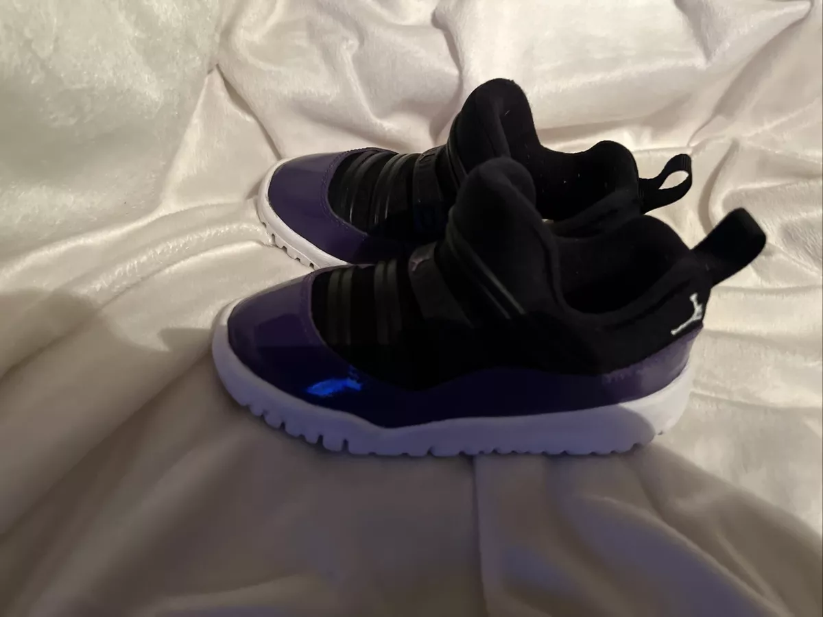 Purple and sales black jordans 11