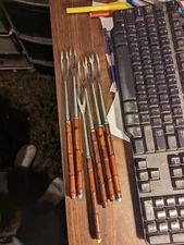 SET OF 6 BAMBOO HANDLED FONDUE FORKS, SOME MISSING PLASTIC TOPS , USED