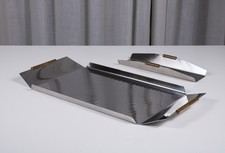 Coppia di vassoi in acciaio Inox, F.A.T.A, Anna Bulgheroni. Italia anni '70