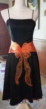Aspeed USA Size Small Black & Orange Bow Front. 42" Long. 18 1/2" Bust