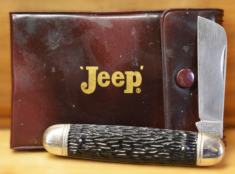 A vintage Jeep-branded Imperial folding knife travel set in black — licensed Jeep gear from when the brand still meant something rugged, a fun macho-nostalgia gift.