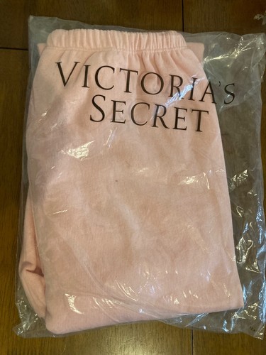 VICTORIAS SECRET SWEATPANTS. XS. LIGHT PEACHY PINK. PINK BLACK GRAPHIC. NWT
