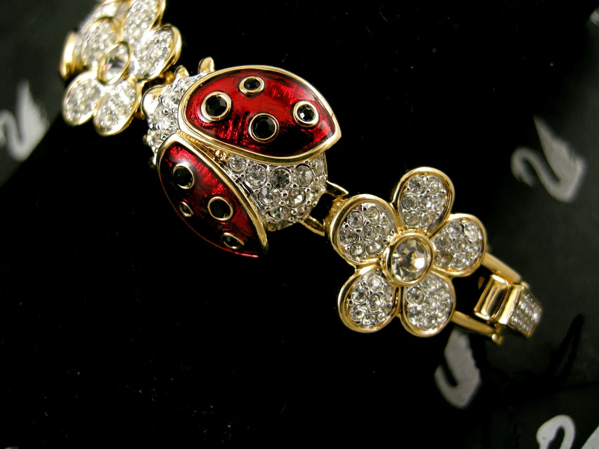 18 kt yellow gold charm bracelet with heart,ladybird beetle,bear,water