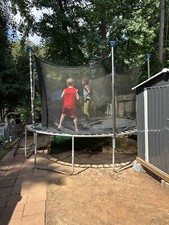 12Ft Trampoline W/Club House Cover/ Ladder  Net With Zipper 2 Yrs Old.