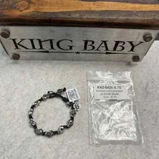 King Baby Bracelet knotted cord w/small skulls. K42-5426 8.75" long