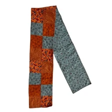 Decorative table runner with butterflies and other patterns, orange and blue