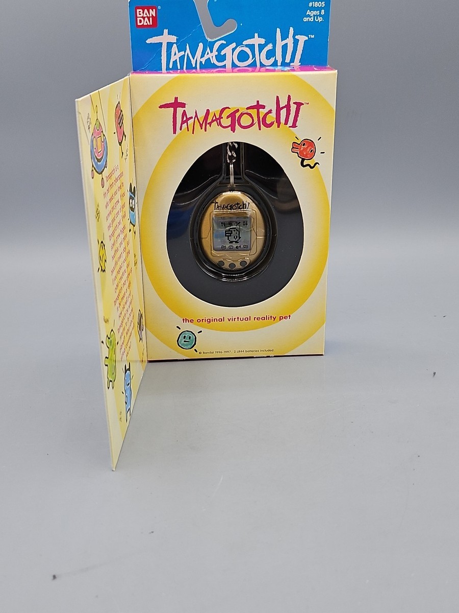 Original 1996-97 Tamagotchi #1805 Gold, Black Buttons, Original
