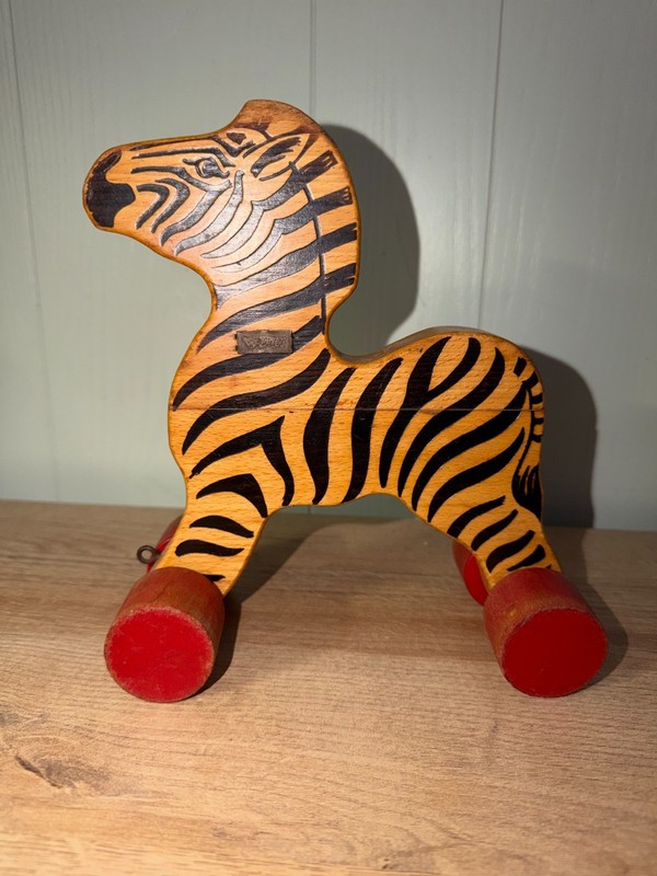 Charming, wooden zebra on red wheels by Steiff, vintage pull toy, 1970s