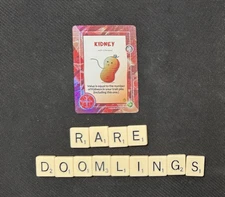 Doomlings: Legends of Enderas - LOE - Holofoil Kidney Dino - Free Ship