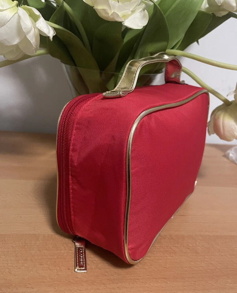 Bolso de cosméticos Clarins Beauty rojo con adornos metálicos de color dorado. Nuevo. Foto 3 de 4