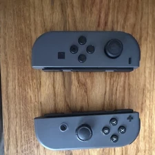 Nintendo Joy-Con Wireless Controllers Gray Pair with Joy-Con Grip for Switch