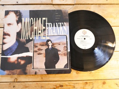 MICHAEL FRANKS THE CAMERA NEVER LIES LP 33T VINYL EX COVER EX ORIGINAL 1987