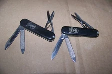 2 (Two) Vintage Edition "ROMAN MEAL" Swiss Army Type Knives.