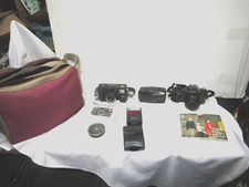 Lot of 35 mm cameras, carrying bag, instruct. booklets--Nikon, Canon, etc.