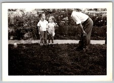 Vtg B&W Snapshot Two Young Boys Lawn Man Bending Down Yard 1940s