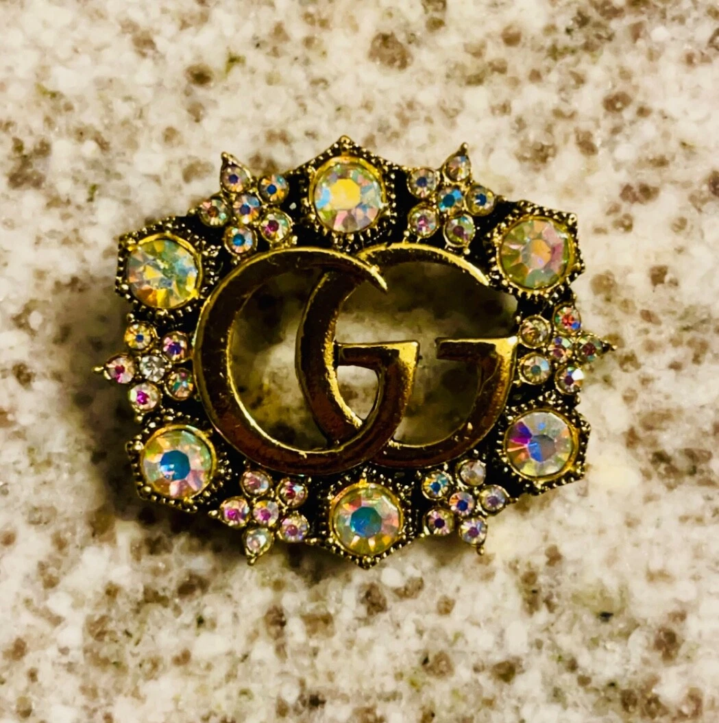 Superbe broche Gucci GG cristal aurore doré