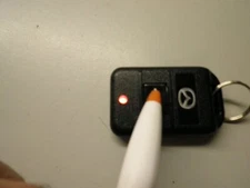 USED MAZDA CODE ALARM KEYLESS REMOTE START FOB SINGLE BUTTON FCC ID# GOH-PCMINI