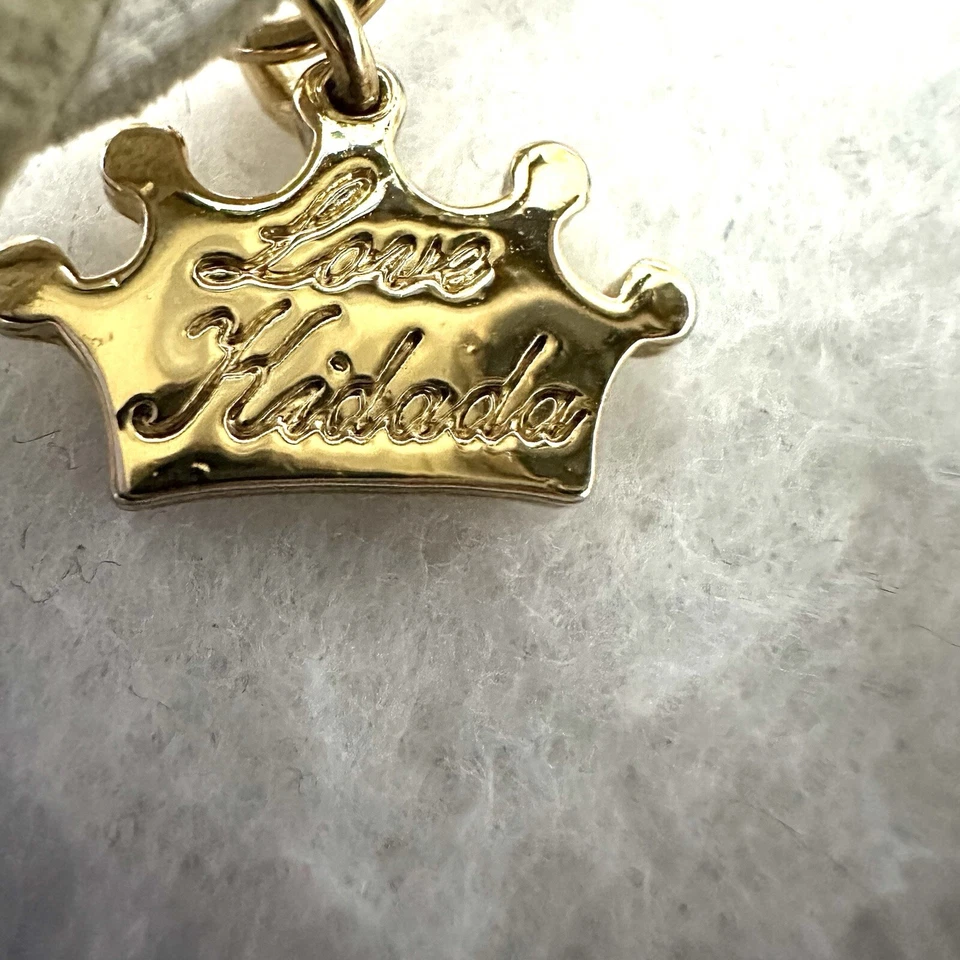 Pulsera envolvente con dijes de princesa de alta costura Kidada Disney tono dorado cuero blanco Foto 4 de 4