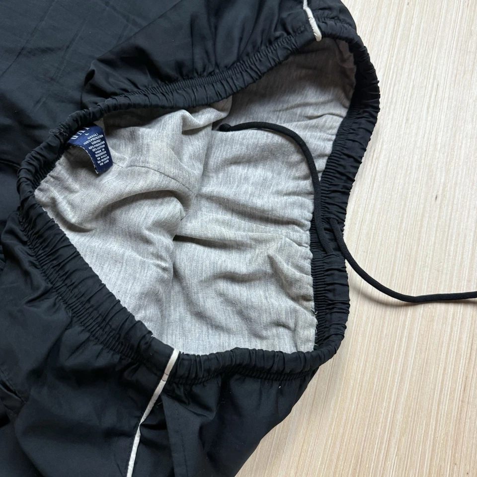 Pantalones cortavientos holgados Y2K vintage Gap L pierna ancha Cyber Mall rayas laterales góticas Foto 2 de 4