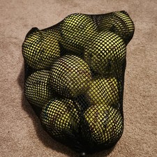 13 Softballs with mesh carry bag