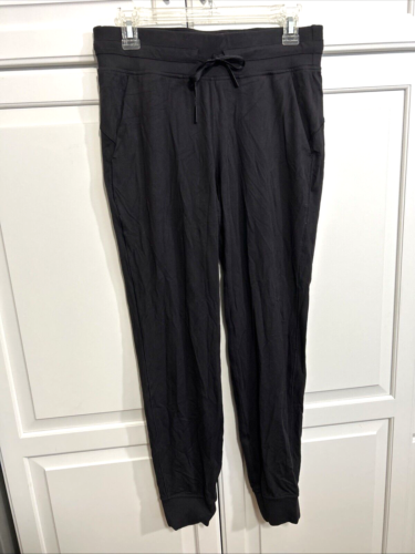 Lululemon black knit joggers, elastic waist, drawstring, pockets, size M