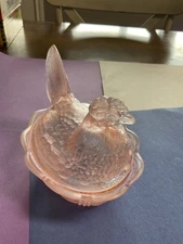 Fenton pink carnival glass nest covered dish.